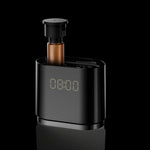 Aroma diffuser with removable scent bottle loaded from the top beside the digital clock