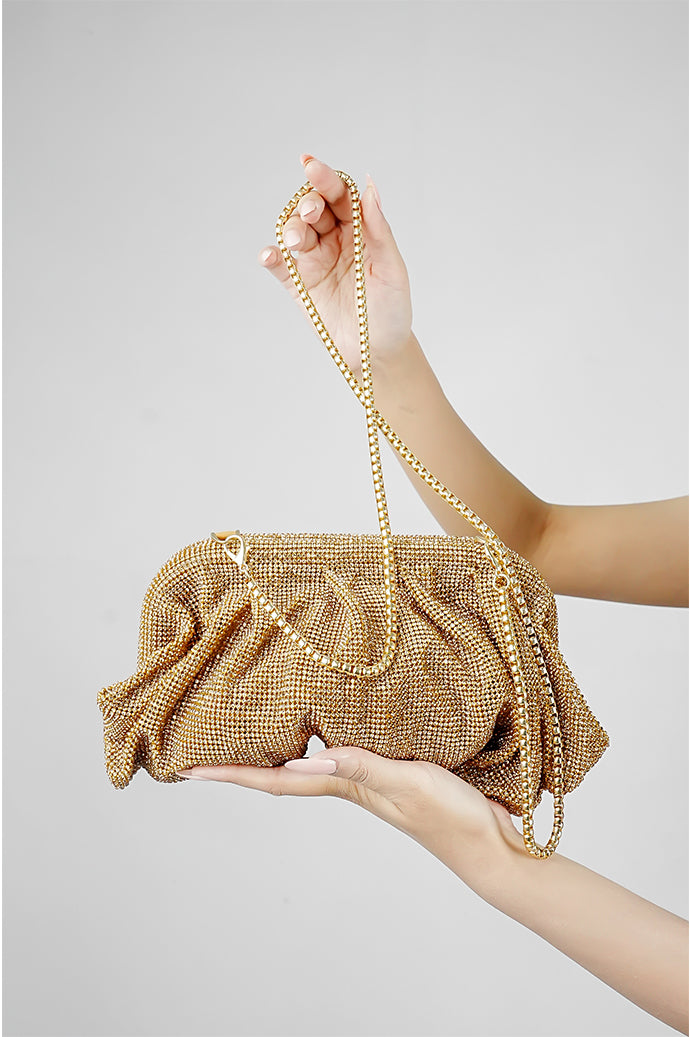 Gold Benedetta rhinestone clutch bag for women held in the hand with matching chain