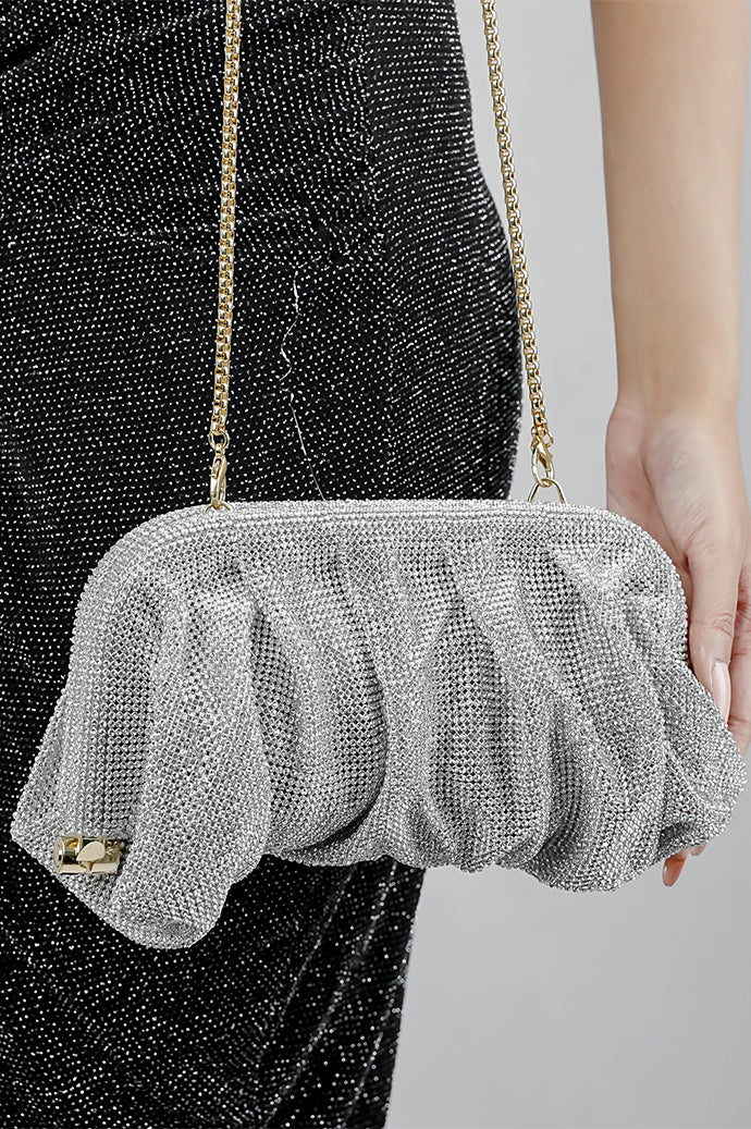 Silver rhinestone clutch bag for women carried by the matching chain