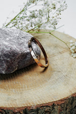 Side view of gold clove stone bangle with stone detail