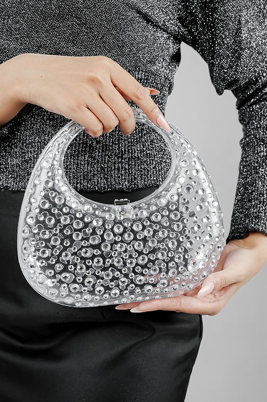 Clear textured clutch bag for women held by the handle, front view, Future Style Pakistan