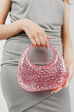 Pink clutch bag for women held in front with both hands, Future Style Pakistan