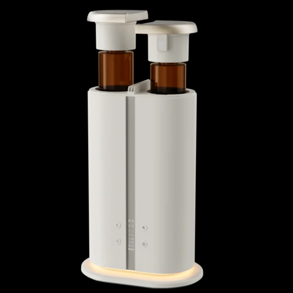 Dual bottle aroma diffuser with two amber scent bottles and L and R buttons