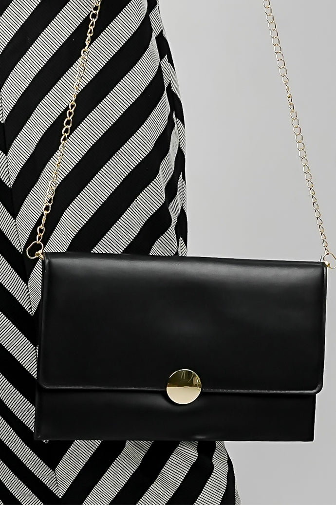 Black Envelope Bag with magnetic closure and gold emblem, side view