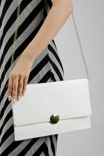 White Envelope Bag with gold chain carried at the side