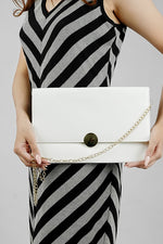 White Envelope Bag with gold emblem and magnetic closure