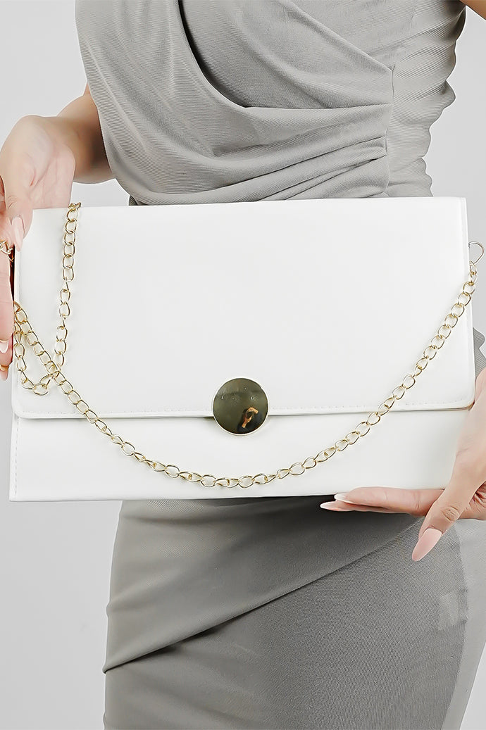Woman holding the white Envelope Bag with its gold chain