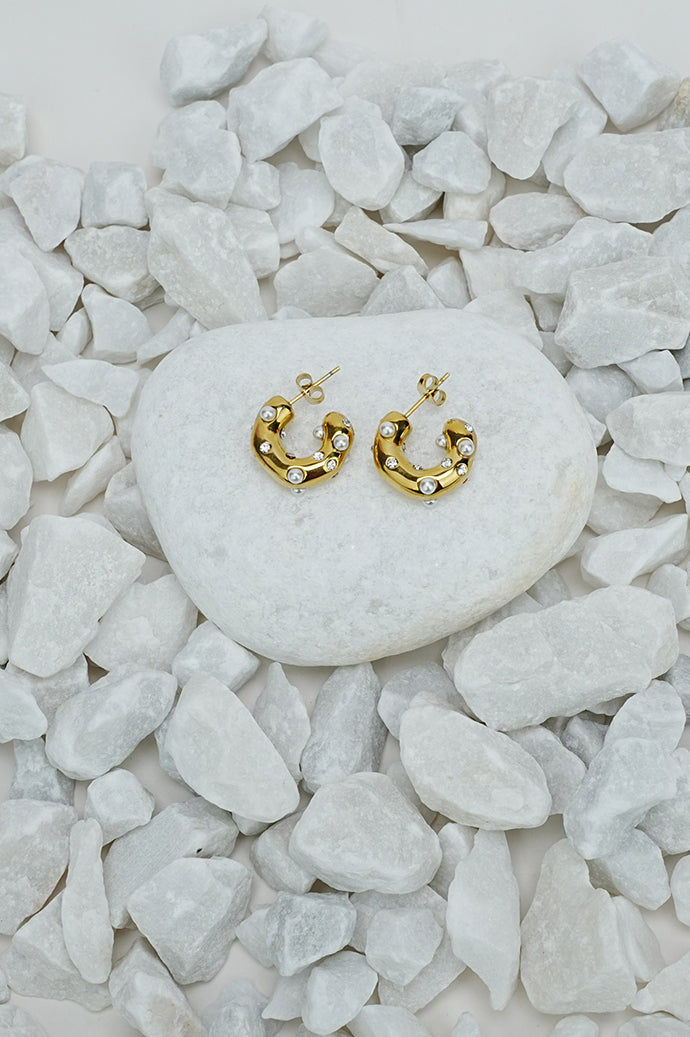 Half crescent hoop earrings with pearl-style beads in gold tone
