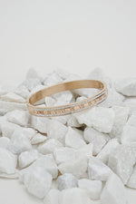 Rose gold Roman rhinestone bangle with engraved numerals on white stones