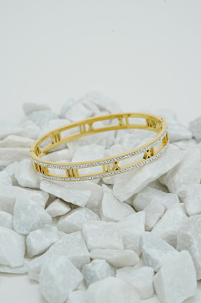 Gold open bangle with Roman numeral design and rhinestones for women