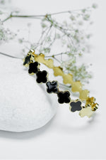 Roman style close bangle for women in gold and black