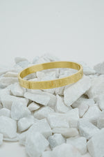 Gold Roman style close bangle for women on white stones