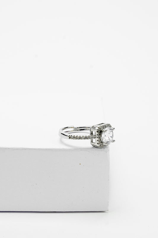 Silver-tone solitaire ring with a single stone