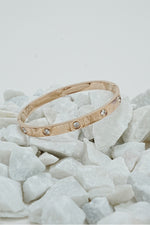 Solitaire bangle for women in rose gold-tone finish with stone detail, Future Style Pakistan