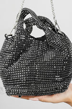 Stellar black crystal bucket bag with chain strap held in hand, Future Style Pakistan