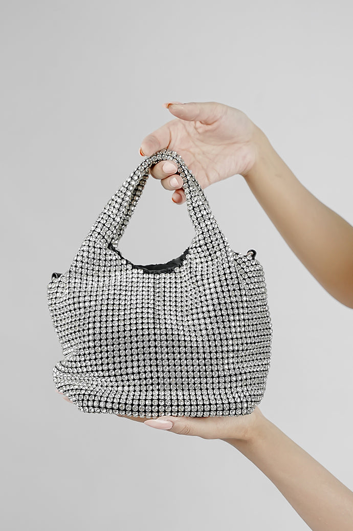 Silver crystal bucket bag held by its handles, product view
