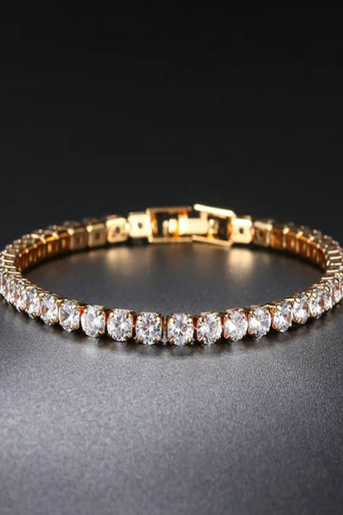Gold-tone tennis bracelet for women with a row of clear round stones and a fold-over clasp, Future Style