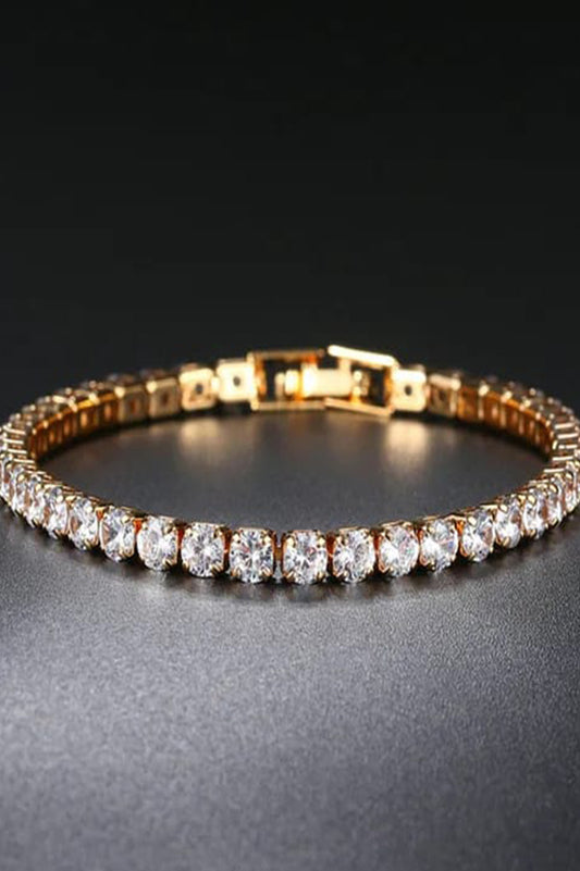 Gold-tone tennis bracelet for women with a row of clear round stones and a fold-over clasp, Future Style
