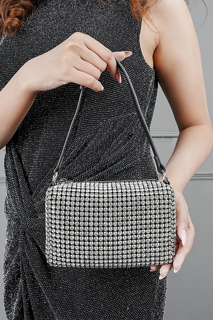 Woman holding the Wang Large silver bag at her waist
