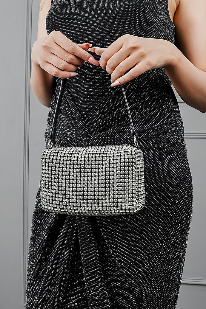 Wang Large silver sparkling bag styled with a black glitter dress