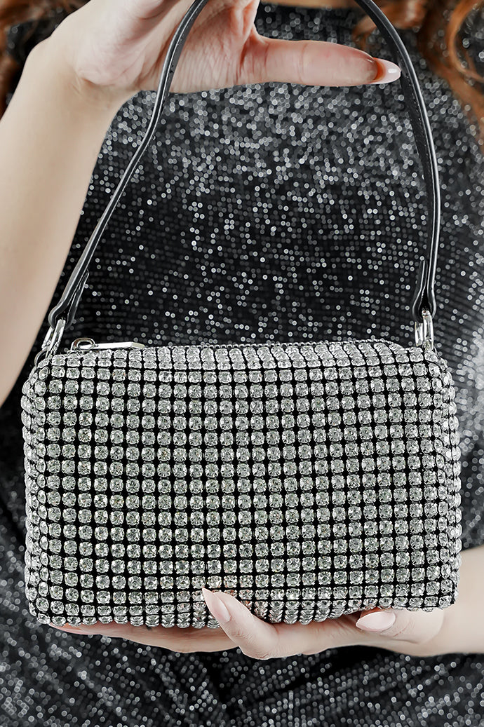 Close-up of the Wang Large silver sparkling rectangle bag held at the front