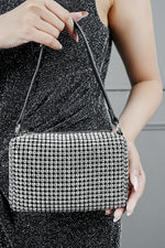 Wang Large silver rectangle bag with black strap, front view on a model