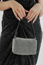Wang Large silver rectangle bag held in both hands, front view