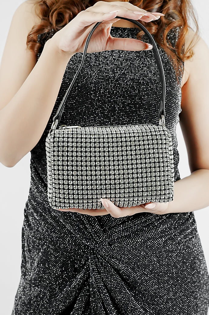Wang Large silver bag with black strap held in front with both hands