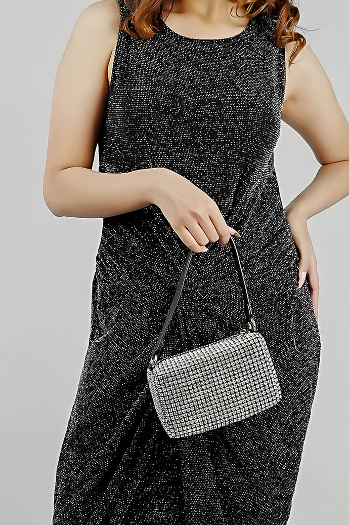 Wang Large silver bag held at the hip with the strap in hand