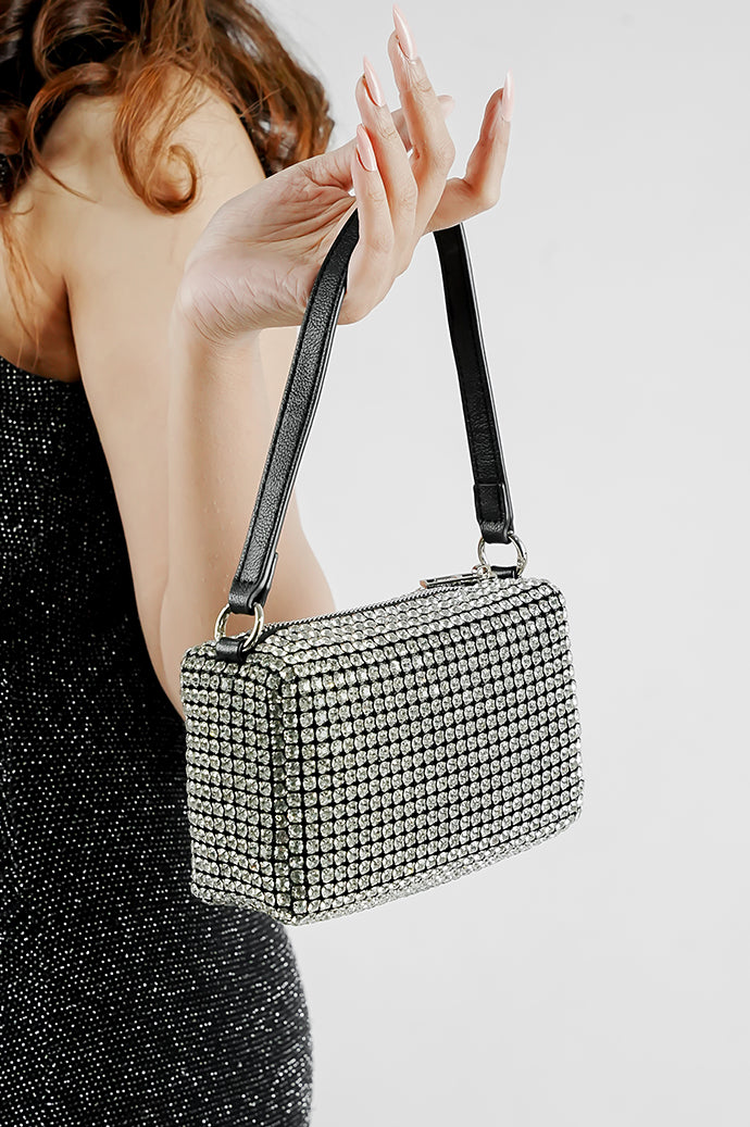 Wang Large silver bag with black strap worn on the shoulder, side view