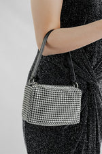 Wang Large silver sparkling bag carried on the arm by its black strap