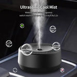 Waterless car aroma diffuser releasing a fine fragrance mist in a car